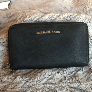 Black Michael Kors wallet.